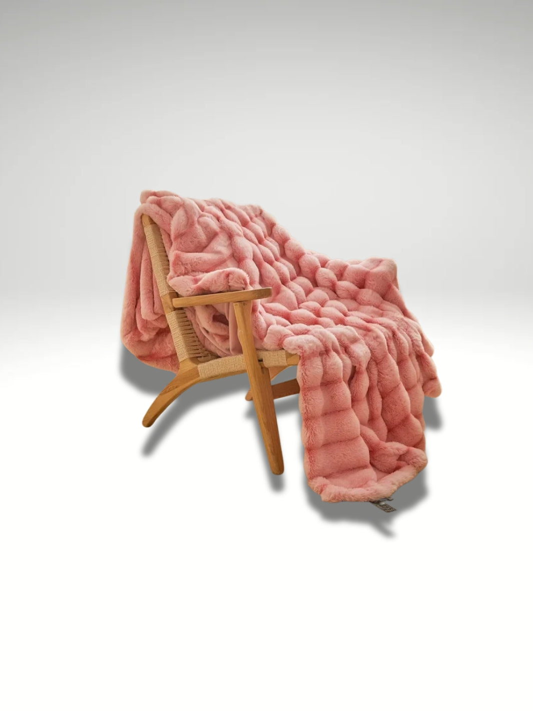 jeté en fausse fourrure rose